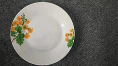 Keramisk blomsterplade